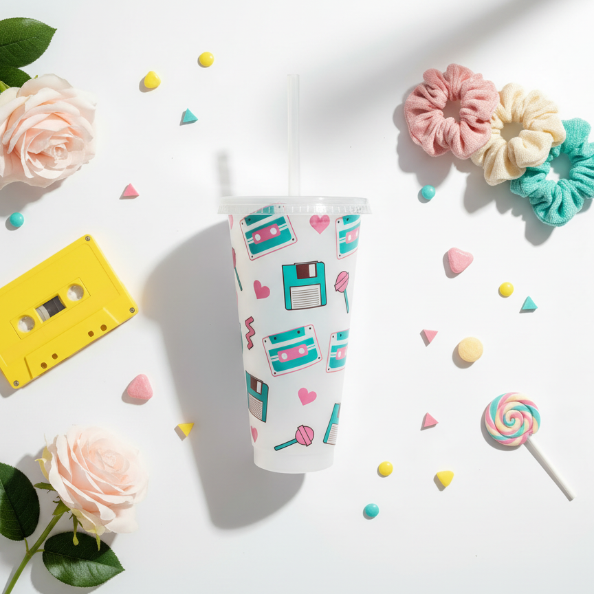 90's Vibe 24oz cold cup UK flat lay with retro cassette tape, scrunchies, and nostalgic 90's props on white background