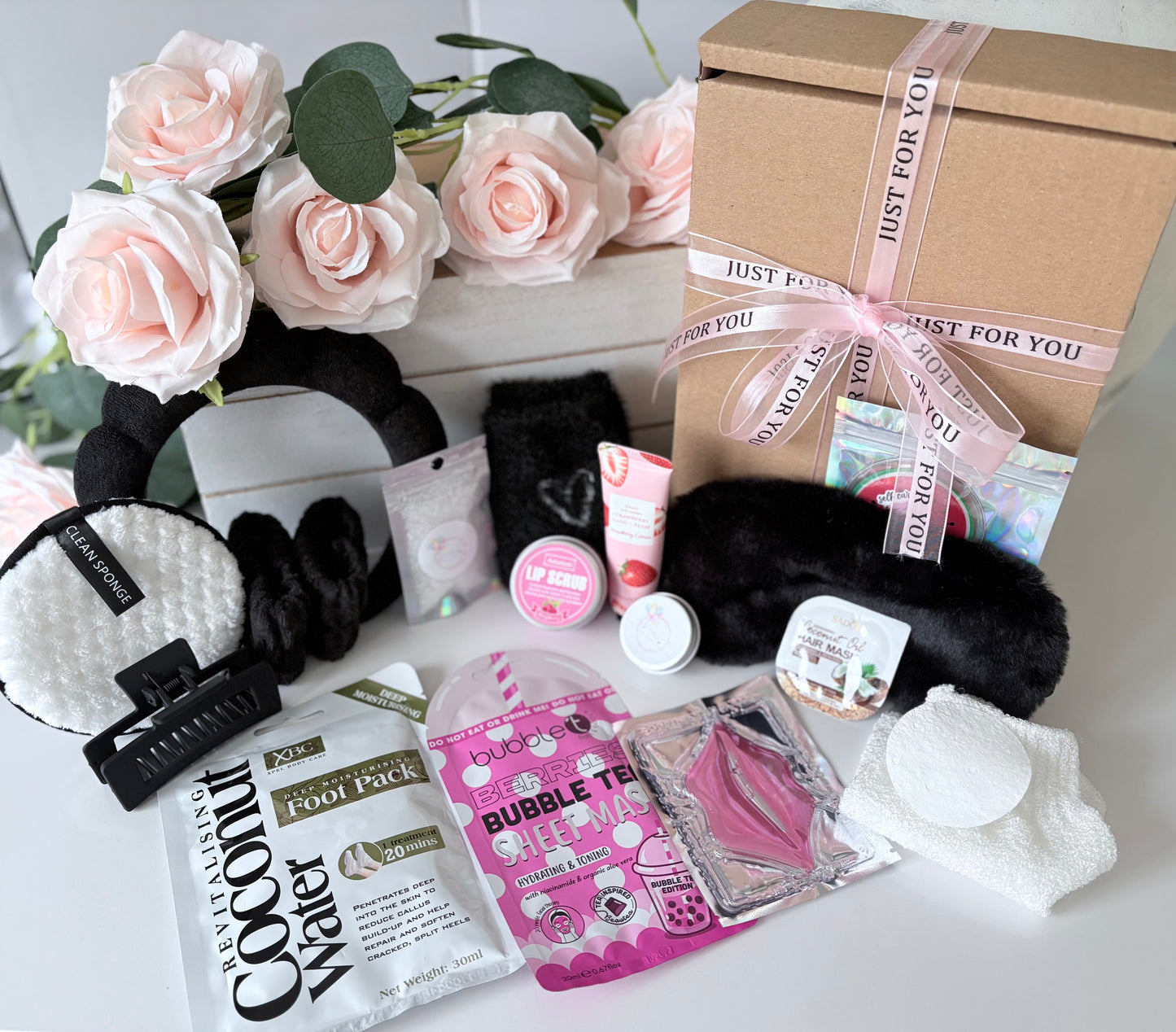Close up of Ultimate Black Pamper box showing spa themed contents - personalised luxury pamper gift UK