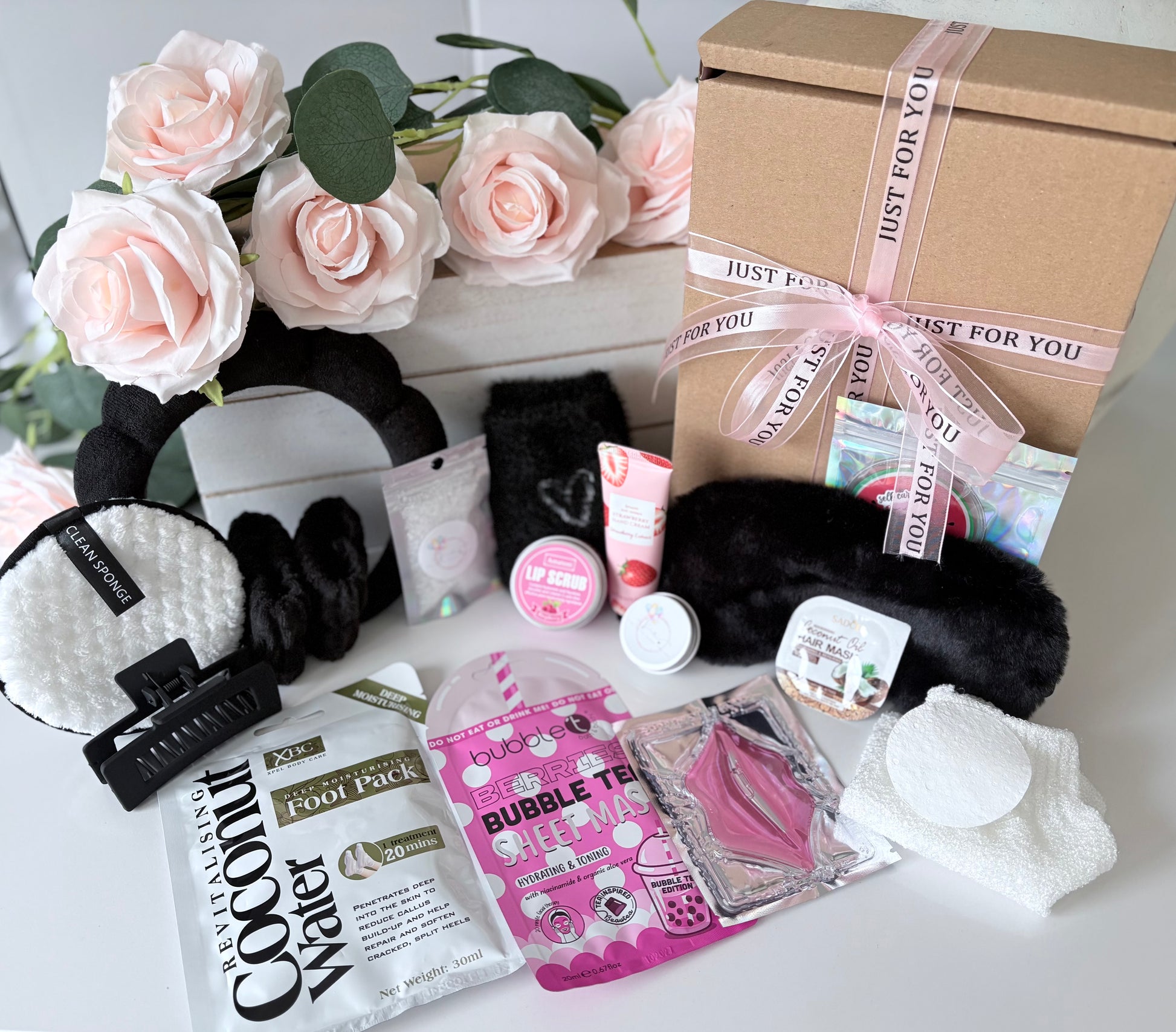 Close up of Ultimate Black Pamper box showing spa themed contents - personalised luxury pamper gift UK