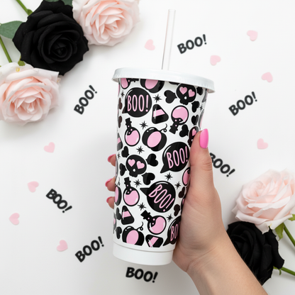 Boo Love 24oz Cold Cup UK - skulls and hearts design held by hand with pink nails, styled with black and pink roses and BOO confetti on pastel background