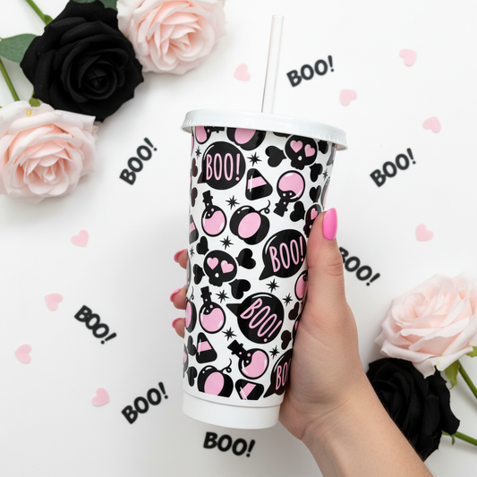 Boo Love 24oz Cold Cup UK - skulls and hearts design held by hand with pink nails, styled with black and pink roses and BOO confetti on pastel background