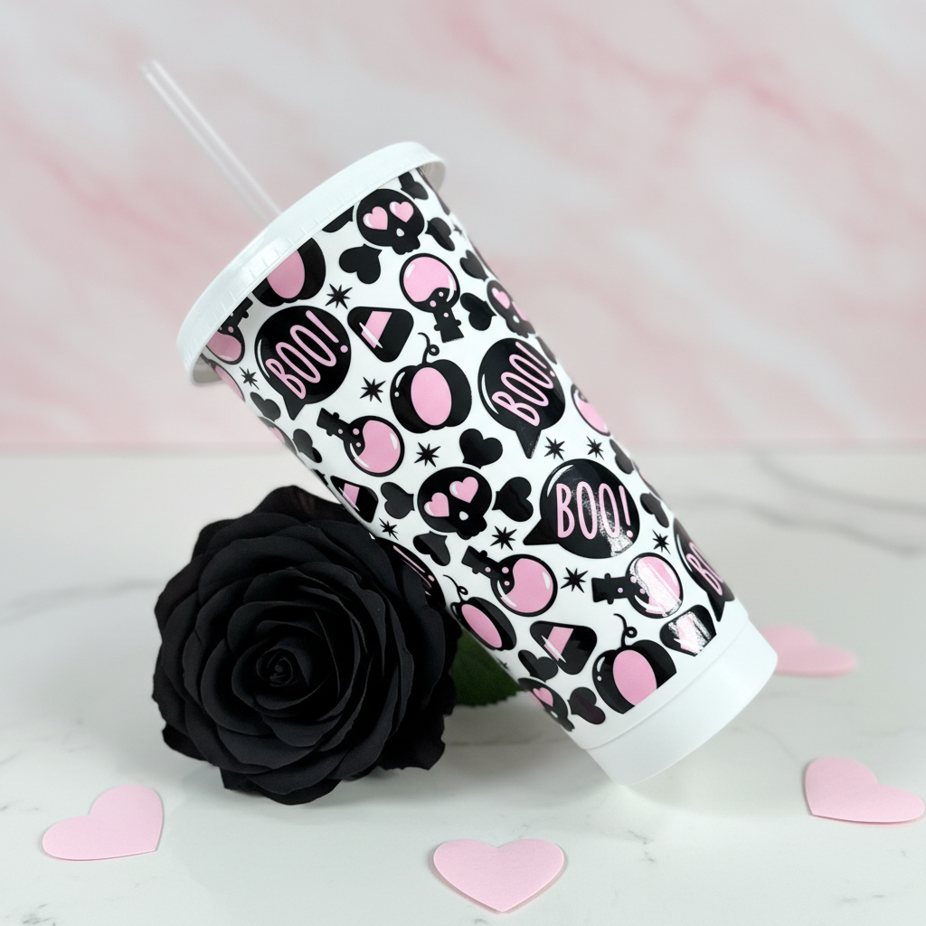 Boo Love 24oz Cold Cup UK laying at an angle with black rose and pink hearts on light background