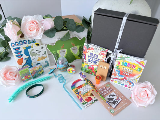 Close up of Dinosaur Gift Box showing dinosaur themed contents - personalised children's gift UK