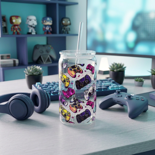 Gaming Controllers 16oz plastic can cup with colourful game controller artwork, clear lid and clear straw in a blue and teal gaming setup.