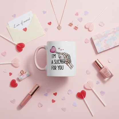 I'm A Sucker For You mug UK overhead flat lay with heart lollipops and girly accessories - romantic gift mug lifestyle shot