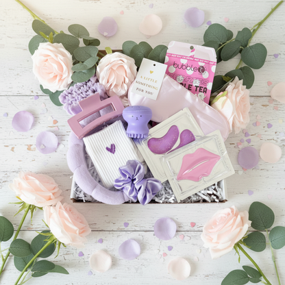 Mini Purple Pamper gift box UK with lavender hair accessories, bubble tea sheet mask, eye patches, lip mask and facial scrubber