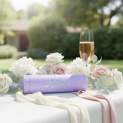 Personalised purple water bottle with custom name on elegant wedding table with white roses and champagne - wedding favour gift UK