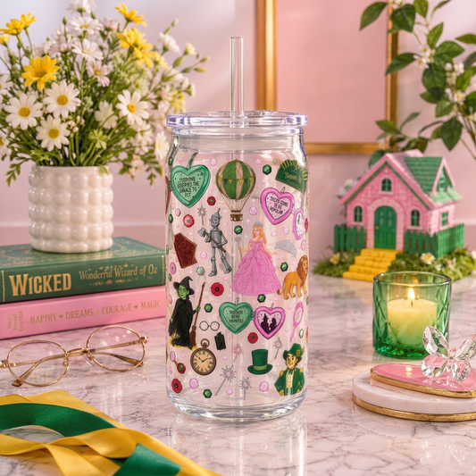Wicked & Oz 16oz plastic can cup with pink and green character artwork, hearts and a hot-air balloon, clear lid and straw.